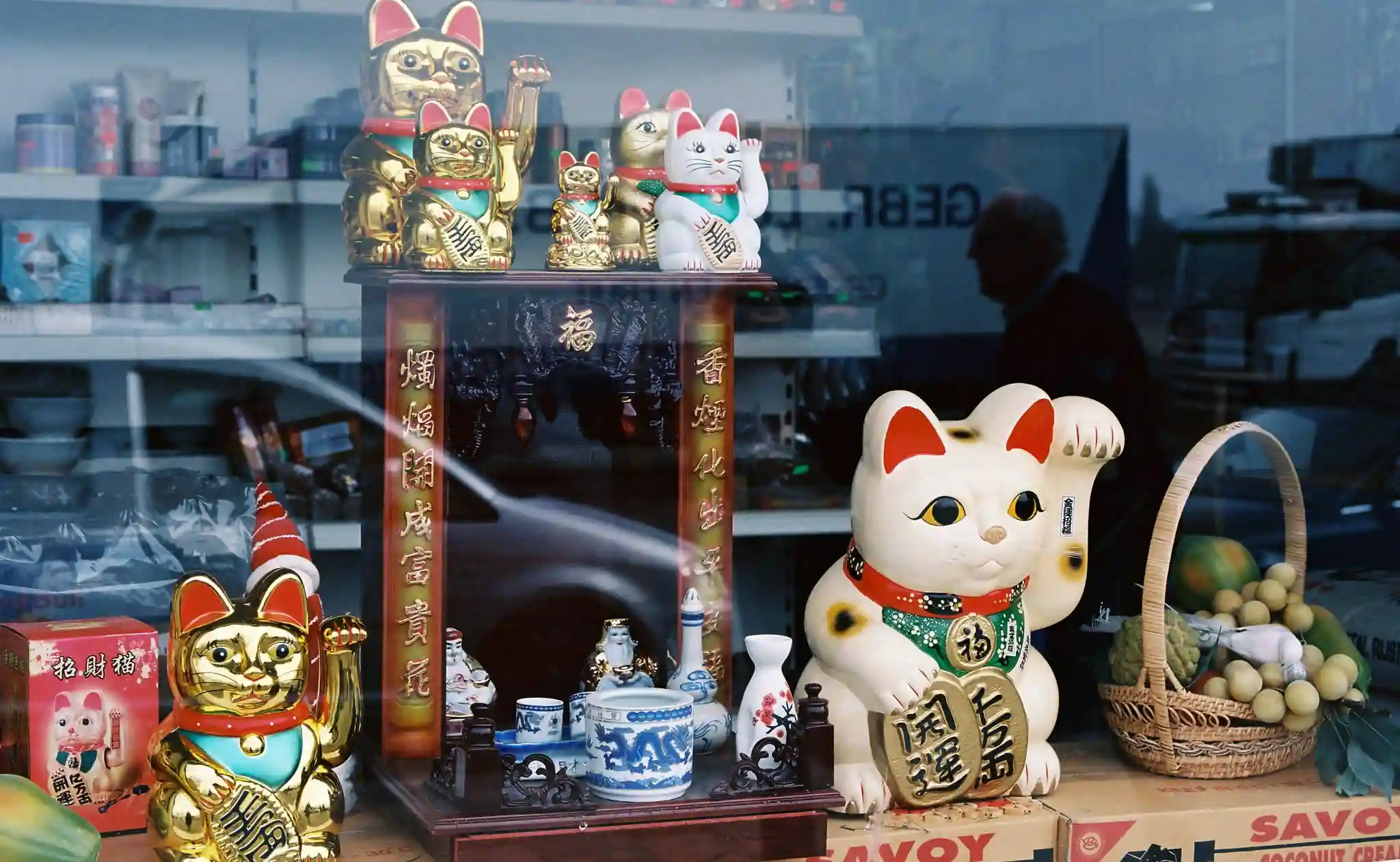 Crafting lucky waving cats, featuring the traditional Maneki Neko for good fortune.