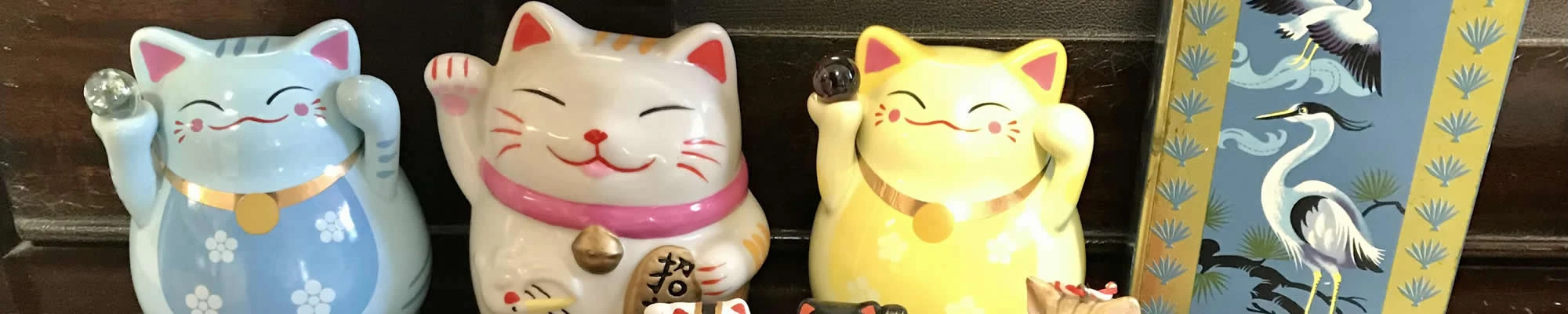 Lucky waving cat and maneki neko collection - Traditional Japanese lucky cat statue